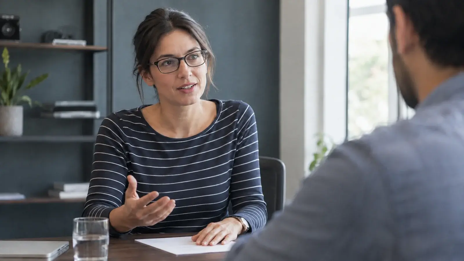 A salesperson asks a follow-up question during a client conversation.
