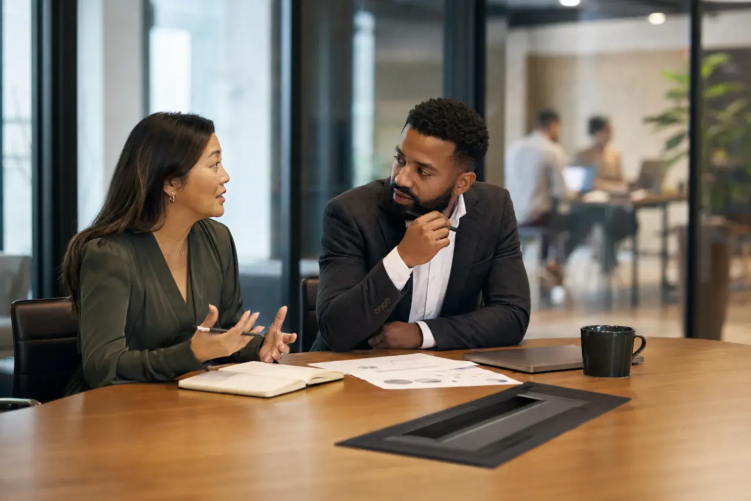 Sales manager in a one-on-one coaching conversation with a rep